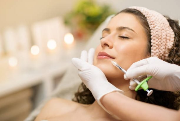 Woman Getting Beauty Injection For Lips. Lip Augmentation and beauty concept