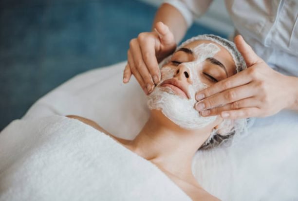 Close-up portrait of anorganic facial mask application at spa salon. Facial treatment. Skin care. Health care. Rejuvenation treatment.